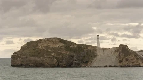 Time-lapse in evening light of Castlepoint lighthouse, Wellington, New Zealand. Stock Footage 134672884