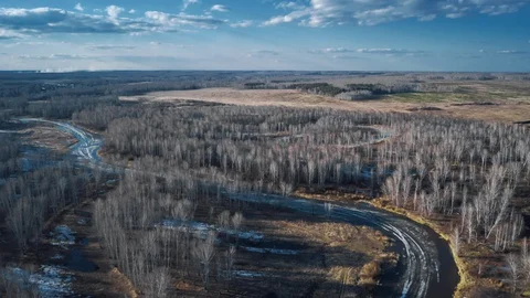 Time lapse of evening sun over the meadows, forests and river Stock Footage 127890816