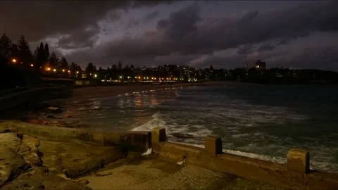 Time lapse evening at Sydney's Coogee beach and surrounding buildings 4K Stock Footage 307653929