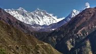 Time-Lapse Of Everest And Surrounding Peaks And People On A Foreground Trail. Stock Footage