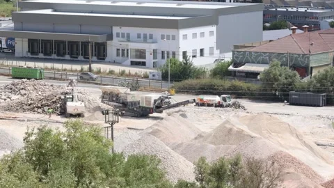 Time lapse Excavator loading crushed stones into truck at construction site Stock Footage 318304332