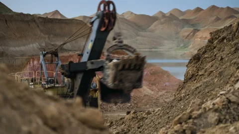 Time lapse of excavator loading ore into dump-trucks at the sunset. Stock Footage 91587607