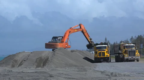 Time lapse of excavator loading trucks in 4k Stock Footage 42576041