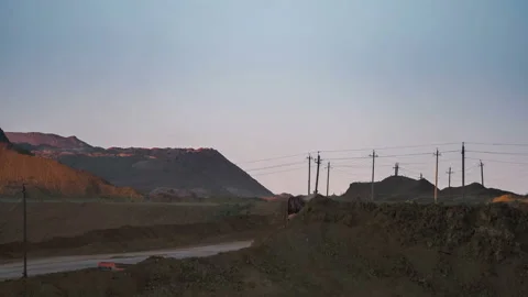 Time lapse. Excavators load ore into dump-trucks. This area has been mined for Video stock 88800138