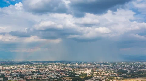 Time Lapse Falling Rain And Rainbow Over City Of Chiang Mai, Thailand (pan shot) Stock Footage 51715682