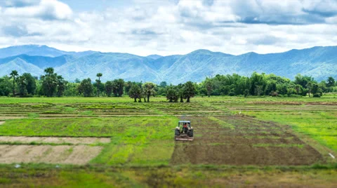 Time lapse farmer user tractor working in farmland for plant Stock Footage 26144032