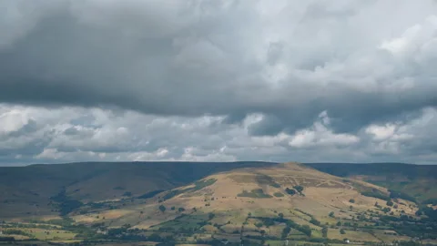 Time lapse. Farmlands under dramatic clouds. Britain. Stock Footage 93616280