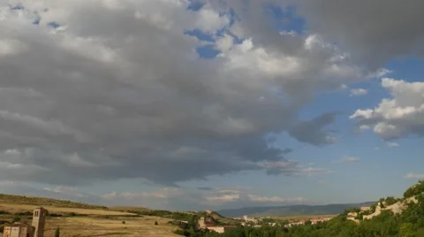 Time lapse of fast building beautiful clouds over a blue sky Stock Footage 64983441
