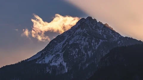 Time lapse fast clouds in misty alps mountain peak sunny winter evening nature Stock-Footage 168730364