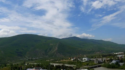 Time lapse, fast-moving clouds over the valley , Georgia Stock Footage 90350354