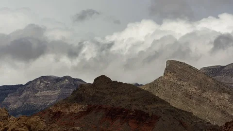 Time Lapse of Fast Moving Clouds Passing Over Mountain Stock Footage