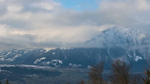 Time lapse of fast moving clouds and trees highlighted in the sun Stock Footage 124171972