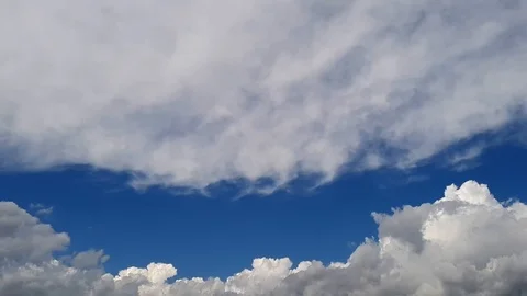 Time lapse of fast moving white clouds and and blue sky. Stock Footage 112511783