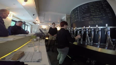 Time Lapse Female Bartenders Working At Beer Tap Counter Serving Clients Stock Footage 344544097