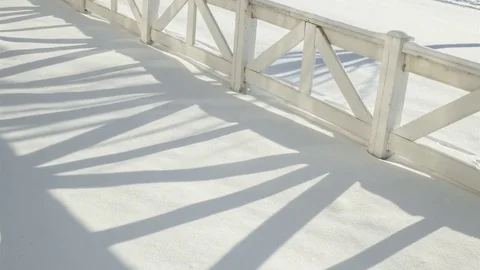 Time Lapse of Fence Shadow Moving Across Snowy Field in Winter 4K Vidéo 71414396