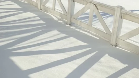 Time Lapse of Fence Shadow Moving Across Snowy Field in Winter 4K Stock Footage 71441693