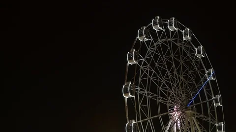 Time lapse of ferris wheel illuminated at night with copy space Stock Footage 123116376
