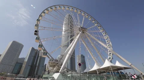 Time Lapse of the Ferris wheel turning near IFC building in Hong Kong Central Stock Footage 45410085