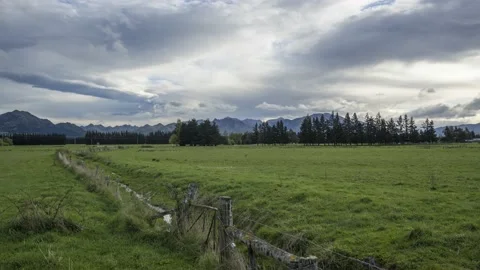 Time-lapse of fields, pine trees and mountains. Hanmer Springs, New Zealand. Stock Footage 134653383