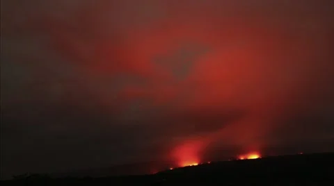 Time lapse fiery clouds reflect night glow over active lava flow, Hawaii Stock Footage 12163071