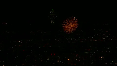 Time lapse of Fireworks explode in the night sky above Milad Tower in Tehran Stock Footage 317910070