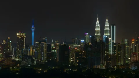 Time lapse of fireworks illuminate the night sky over the Kuala Lumpur city Stock Footage 101063204