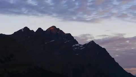 Time lapse first light on mountain peak at sunrise Stock Footage 96901280