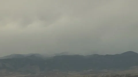 Time Lapse of First Snow Falling onto Rocky Mountains in Autumn Stock Footage 54717357