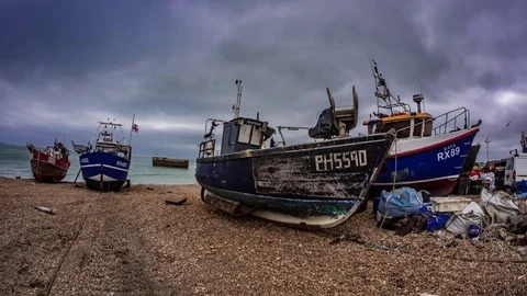 Time lapse fish eye view of fishing boats on the beach at Hastings, England Stock Footage 84422520