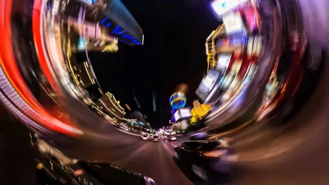 Time lapse fish-eye view of cars driving on the Las Vegas strip at night Vídeo Stock 221807309