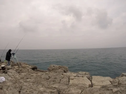 Time lapse fisherman in Polignano a Mare, Italy Stock Footage