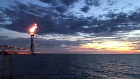 Time lapse of flare burning bridge of oil and gas platform or offshore platform  Stock Footage 242497581