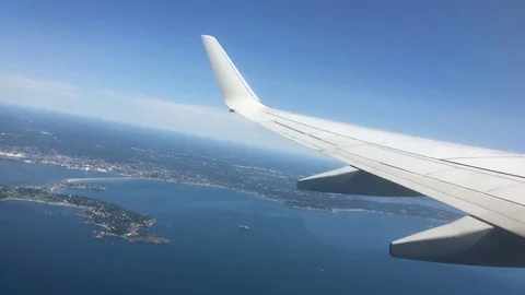 Time-lapse of flight during sunny day overlooking plane wing. Stock Footage 122342246
