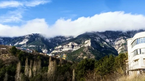 Time-lapse floating clouds over the mountains Stock Footage 86450988