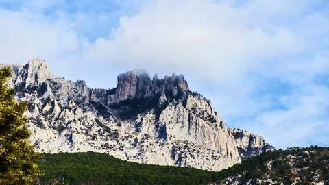 Time-lapse floating clouds over the mountains Stock Footage 86451017
