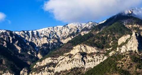 Time-lapse floating clouds over the mountains Stock Footage 86451148