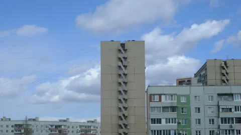 Time-lapse of floating clouds over provincial city. Panel multistoried houses. Stock Footage 132167397