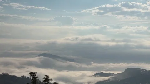 Time-lapse of flowing sea of clouds over mountains in Yuanyang, Yunnan, Chin Stock Footage 328783250