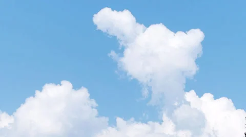 Time-lapse of fluffy clouds on blue sky Stock Footage 35627919