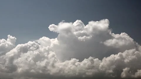 Time lapse fluffy clouds drifting across blue daytime sky - Open Sky and Stratus Stock Footage 339508316