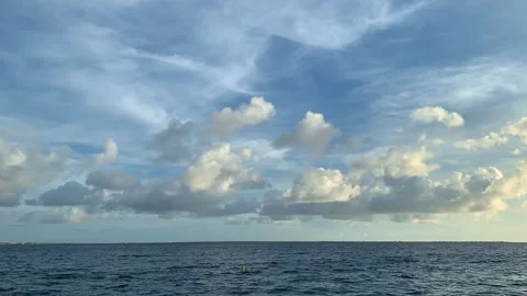 Time Lapse of fluffy clouds flying over the sea. Stock Footage 190940098