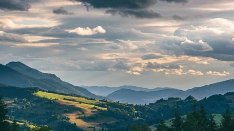 Time lapse of fluffy clouds motion fast rural countryside nature summer sunset Stock Footage 211778350