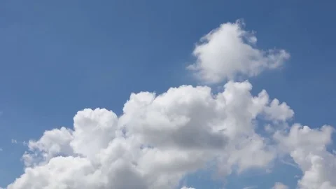 Time-lapse fluffy clouds moving above blue sky Stock Footage 82373188