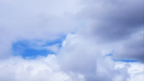 Time lapse of fluffy clouds moving Stock Footage 97055608