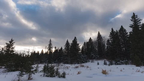 Time lapse of fluffy white and grey clouds moving quickly through a bright blue  Stock Footage 119848436