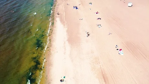 Time lapse Flying over the beach with people walking Stock Footage 125894820