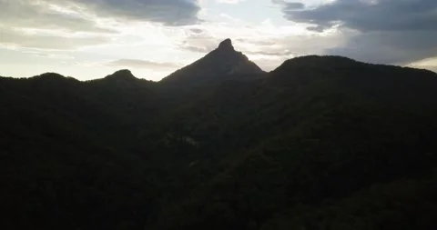 Time Lapse of Flyover of forest mountain landscape at sunset Stock Footage 155457910
