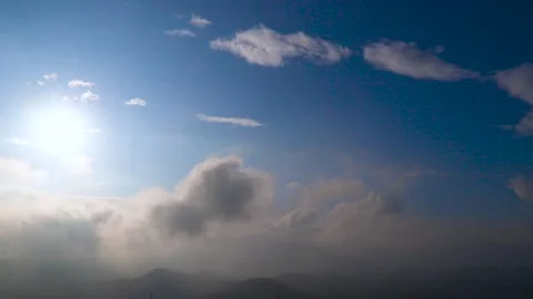 Time-Lapse Fog Above Mountain And Sunlight Through Clouds At Sunrise Video stock 170154768