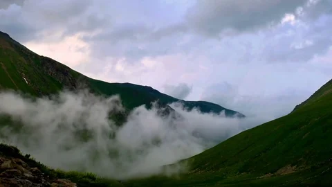 Time lapse of fog and clouds rolling over spring mountain green valley in Kavkaz 스톡 동영상 71197054