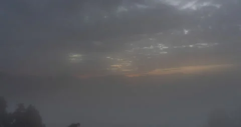 Time-lapse of Fog and clouds float above the mountain tops. Stock Footage 223163601